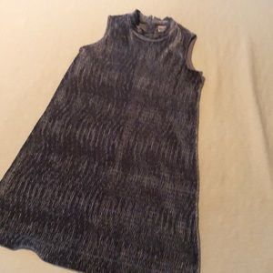 Sleeveless velour gray/silver top.  Has a flair at the bottom.